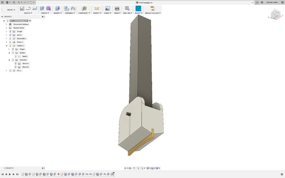 A screenshot of a model in Fusion 360 showing the arm of the arbour press and the fret-press bit and a white block that will connect them.