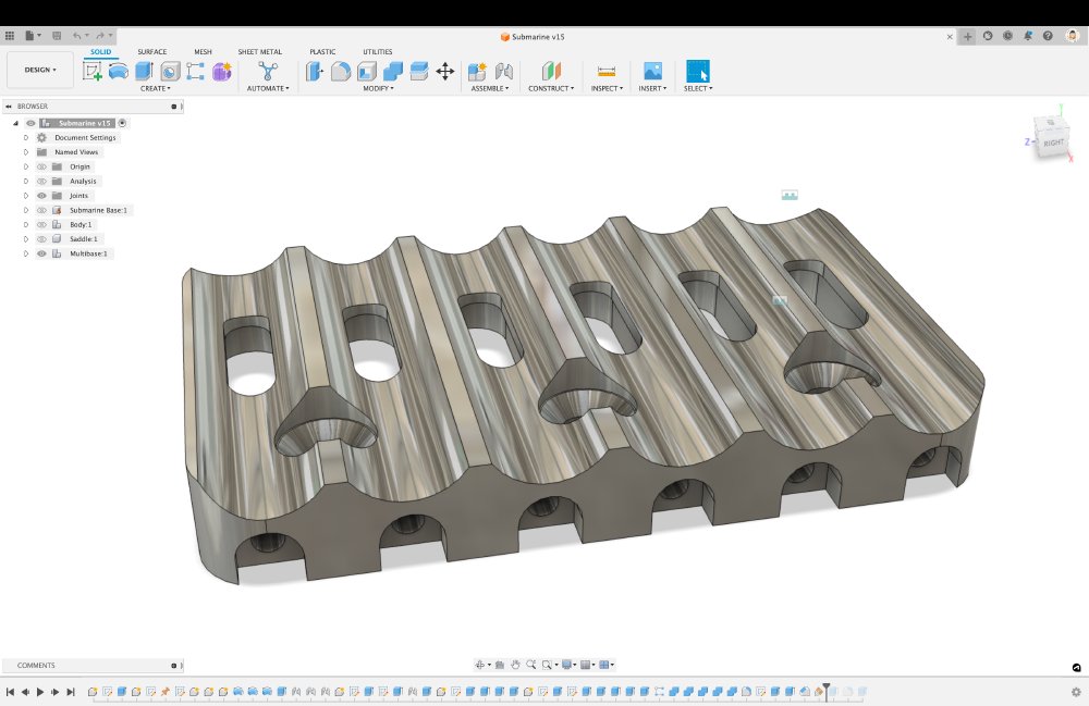 A screenshot of a CAD model of a single metal part that has a set of ridges in it and some screw holes for bits unseen. It's a bit abstract.