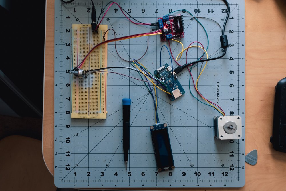 A collection of electronics part sites on a craft board, all connected by random wires.