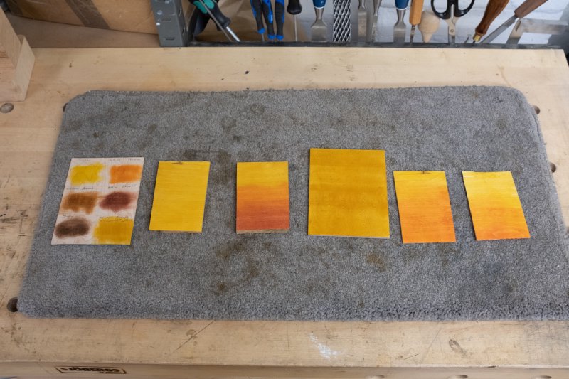 A collection of six postcard sized bits of maple with different shades of yellow and orange on them, some solid colour, and some with blends between them.
