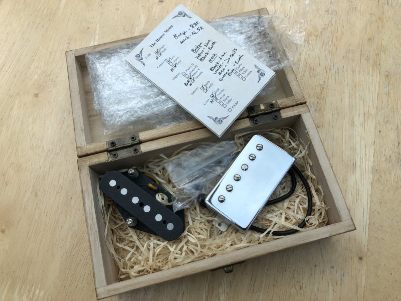 A wooden box containing a humbucker pickup and a telecaster bridge pickup, and of course the little card with the details of the pickup on it. Both pickups seem quite hot, with the neck at 12.5k and the bridge at 8.8k.