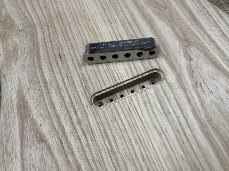 A picture of the rear of the guitar, without the template now, showing the ferrule block next to the neat pocket into which it'll eventually live.