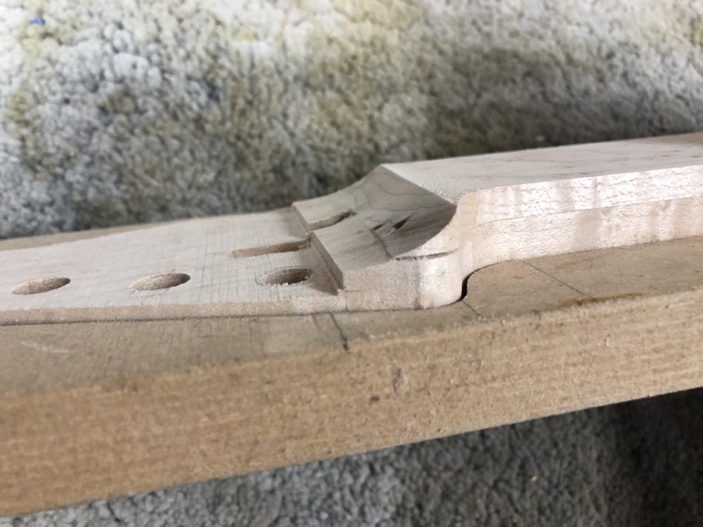 A look at the partially worked headstock to fretboard transition on the neck. You can see some burning again, but from this angle you can also see there is a gap appearing between the fretboard and the body of the neck that wasn't in the earlier pictures.