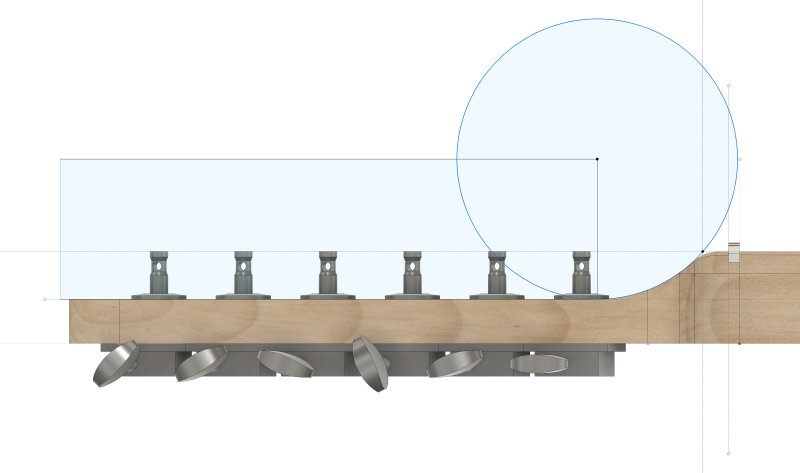A screenshot of the CAD model for the neck. It's a side profile showing the headstock and top end of the neck, with the curved trasition from one to another, and showing the reference circle used to define the arc. That circle is the same size as the largest spindle on the spindle-sander I use.