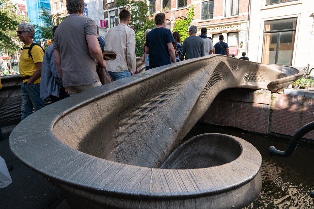 A close up of one end of the bridge, showing the ridged texture of the surface on the bridge, where you can see how each layer of metal was laid down.