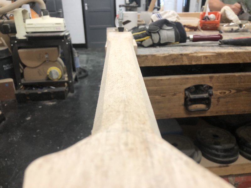 The same neck as in the previous picture, but now there are more facets cut into the length where you'll hold the neck whilst playing, bringing it a little closer to being rounded.