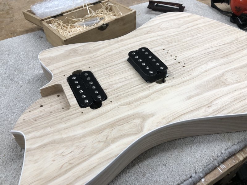 Two pickups are placed to show how the guitar will look when finished, but only the neck pickup sits in the pickup-cavity, the bridge pickup sits on top of the cavity seen in other pictures.