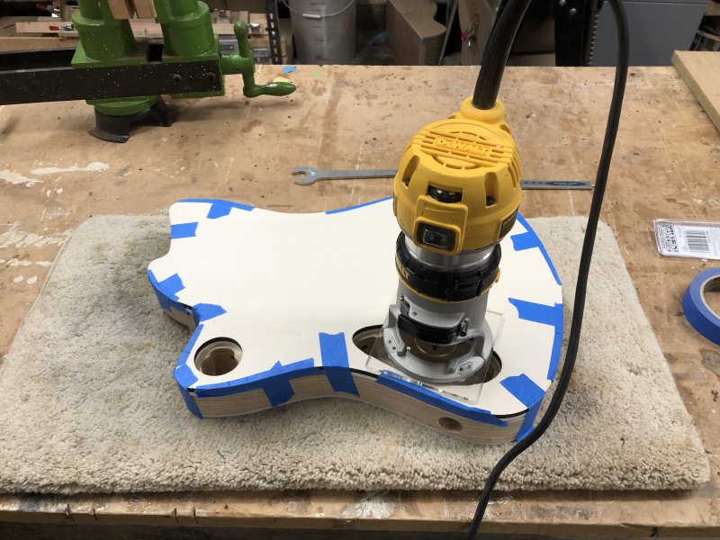 A shot of the Dewalt palm router sat on the template over the main electronics cavity, ready to trim the top edge of the cavity for the cover.