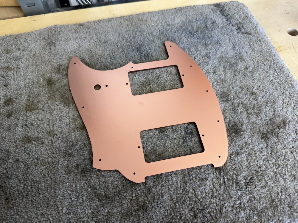 Another photo of the pick-guard, only now it is copper coloured having been spray painted.