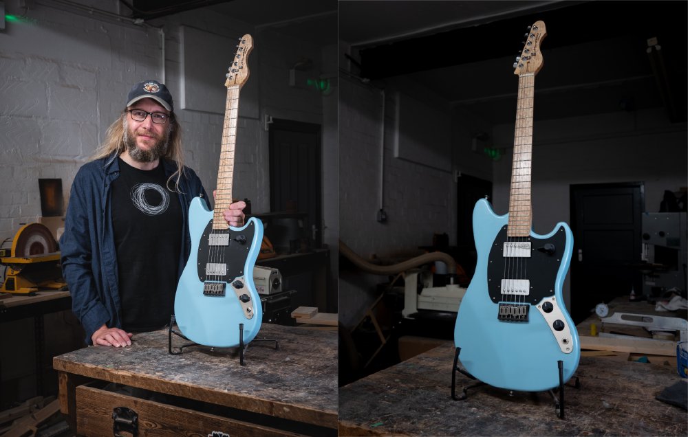 A pair of photos. On the left is a photo of me next to a blue offset-style electric guitar in a stand on a workbench in a moodily dark workshop. On the right is the same guitar just without me in the frame.